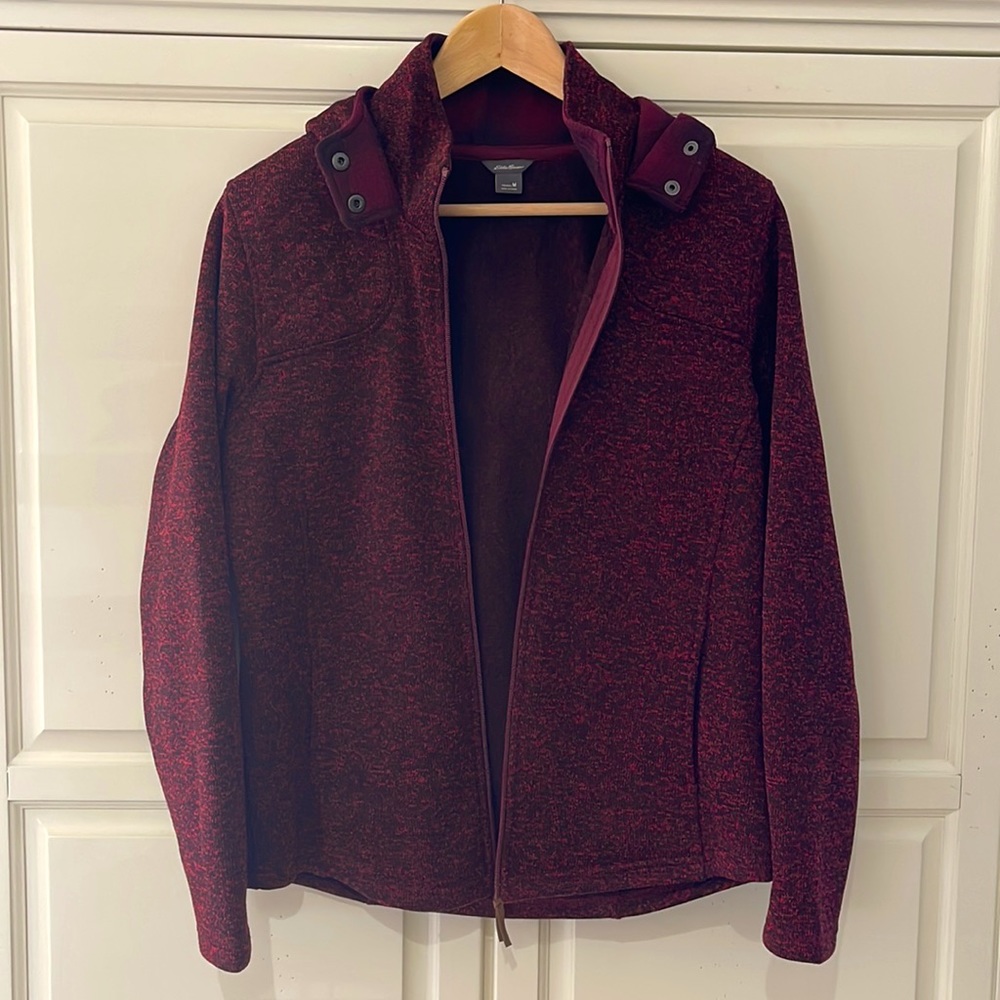 Red and black Eddie Bauer zip up jacket with plaid detailing.